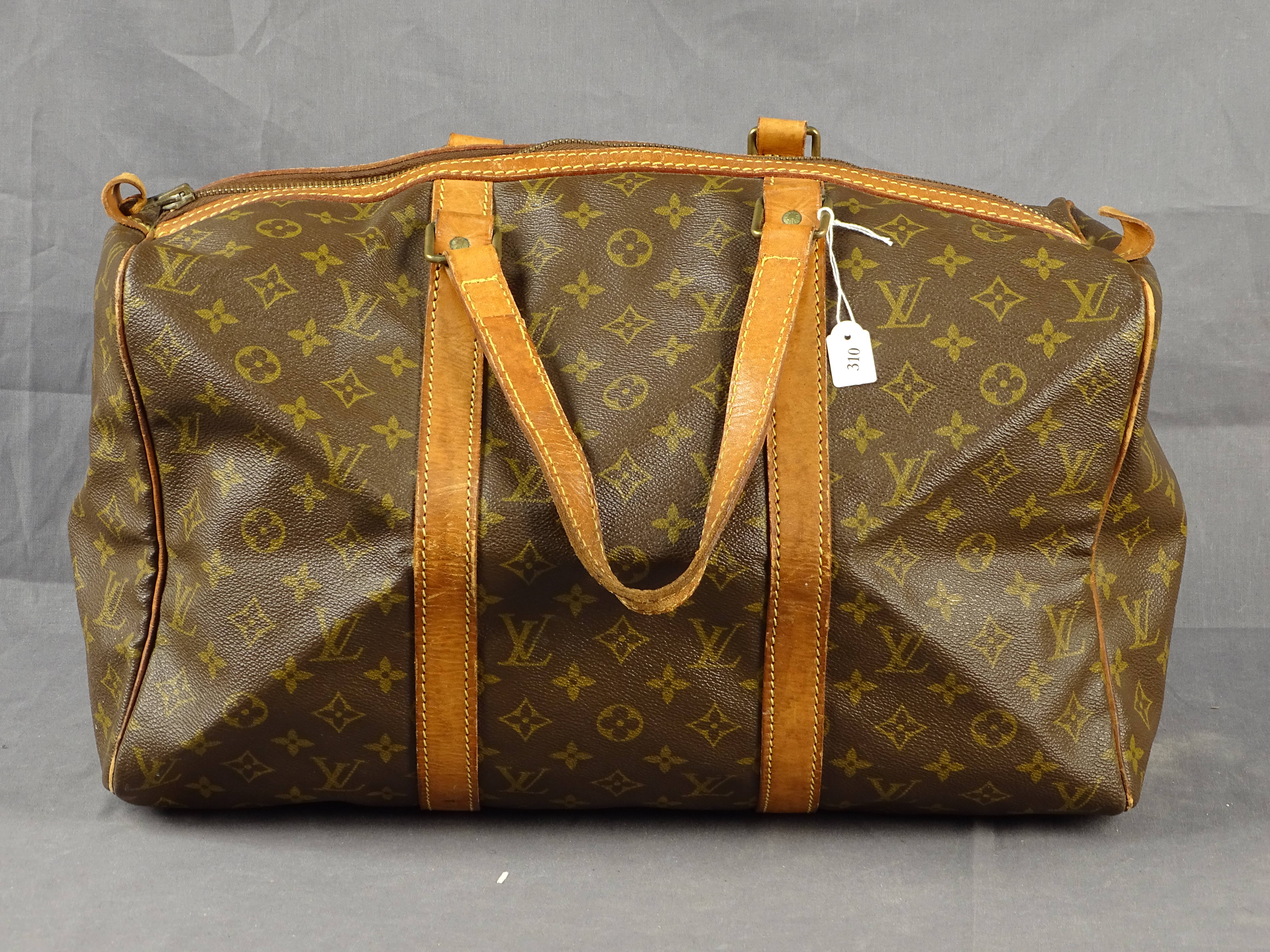 Sold at Auction: Louis Vuitton, Louis Vuitton, sac de voyage Toile Monogram  et cuir naturel, intérieur en t