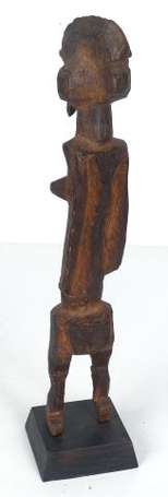 Ancienne statuette votive en bois dur. 