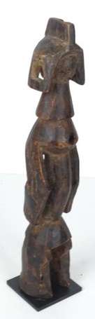 Ancienne et amusante statuette à la bouche en 