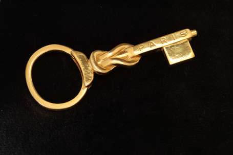 GUCCI - Porte-clefs en métal doré. H. 8,5 cm